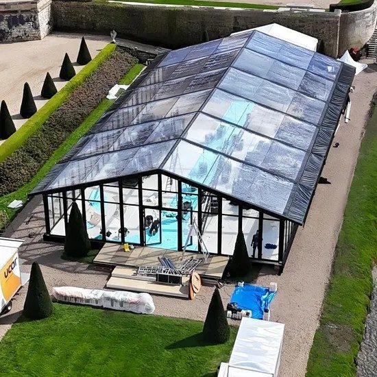 Black aluminum A-frame marquee with transparent roof and glass walls