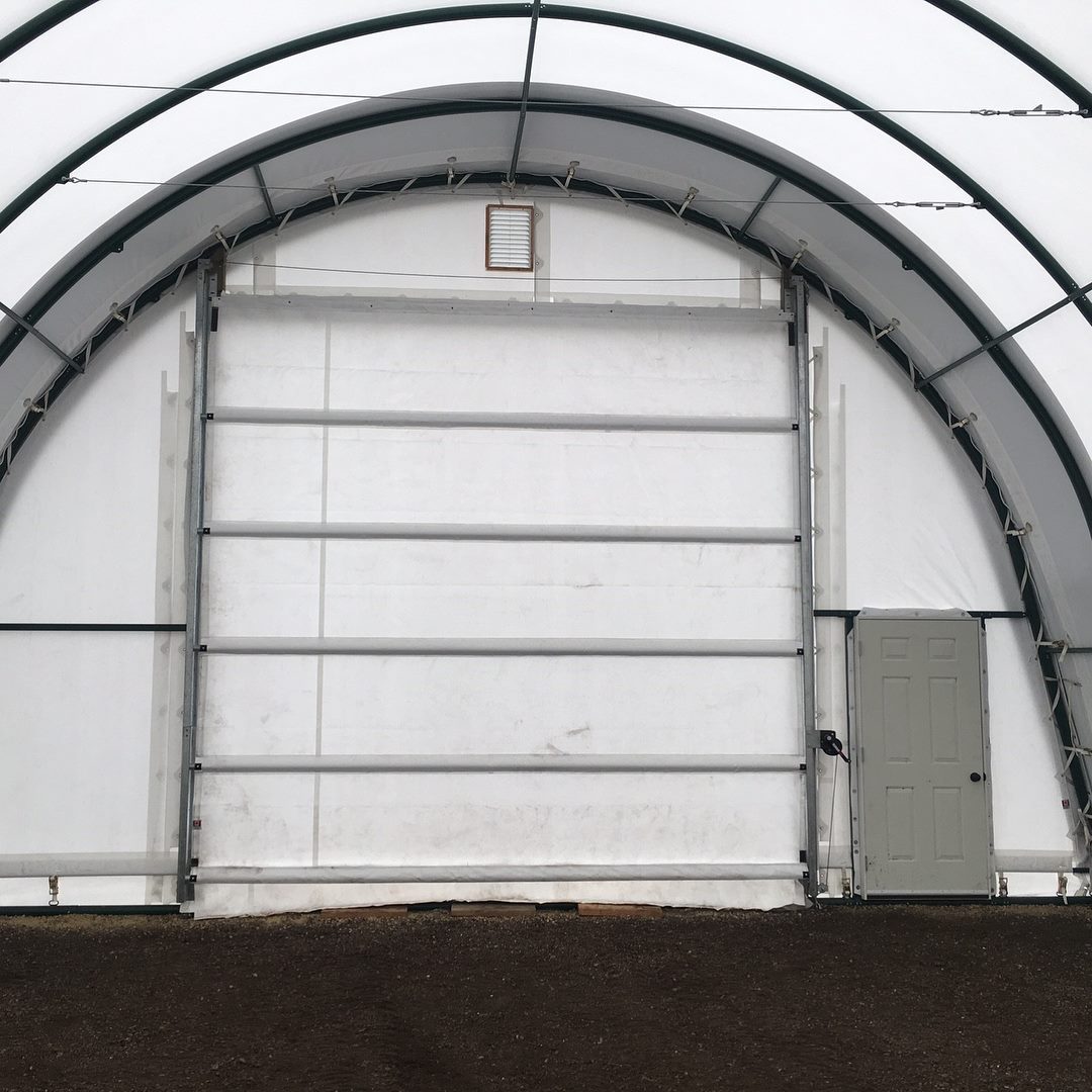 Helical Earth Anchors vs Concrete Footings: Geotechnical Pull-Out Capacity for Clear-Span Fabric Buildings