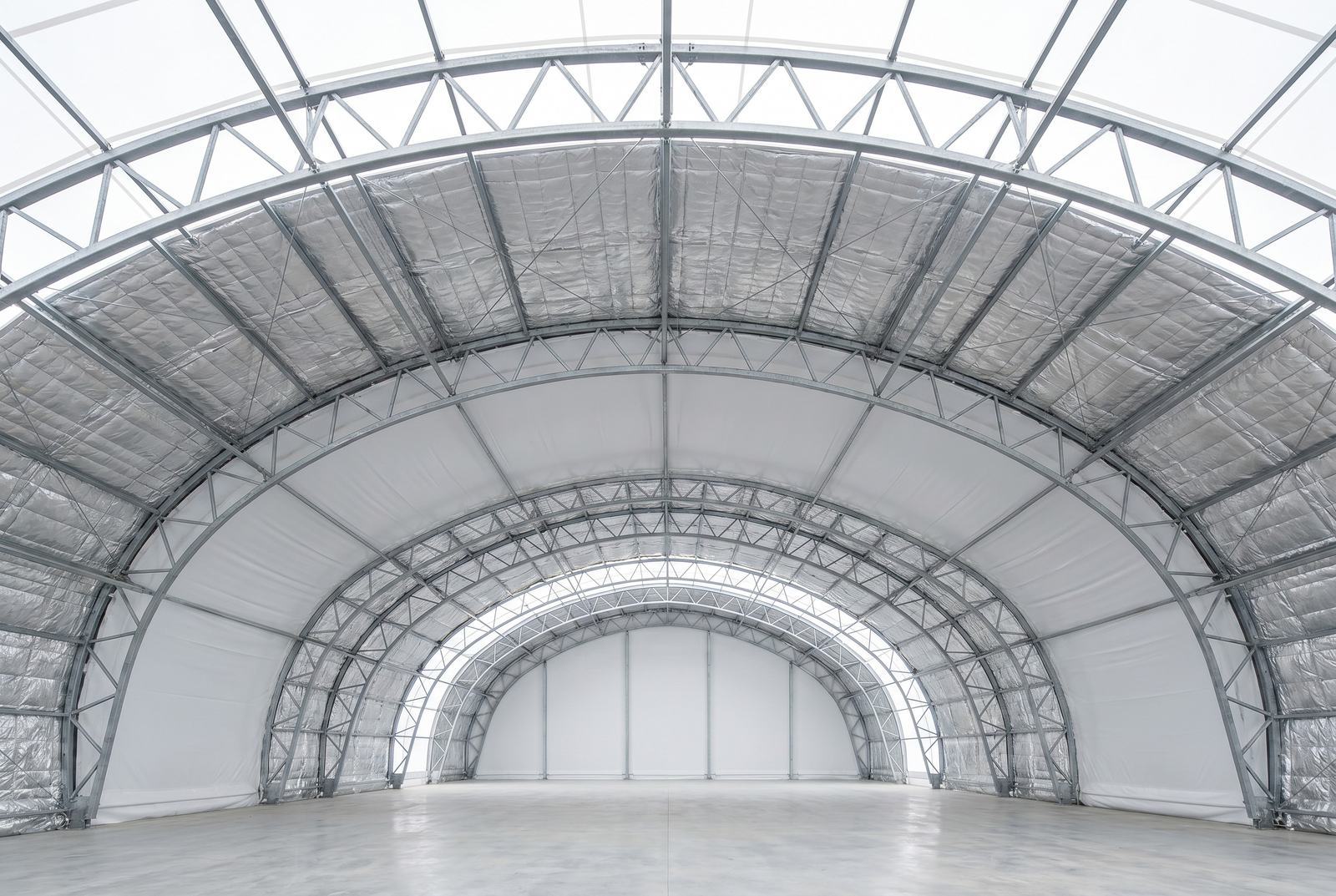 Insulated fabric building interior with thermal liner